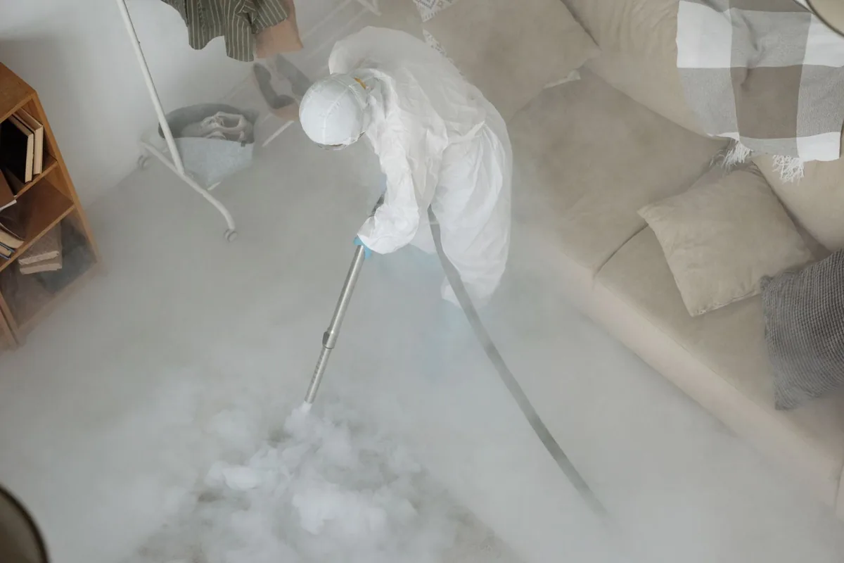 Biohazard cleanup technician in protective equipment, Ely, MN